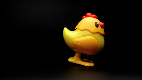 Clockwork yellow toy chicken. Stock Footage 106997596