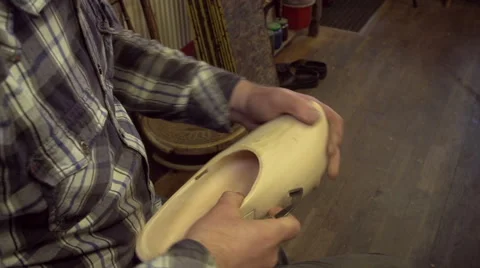 Clog maker is cutting decoration in clog with a gouge Stock Footage 47074993