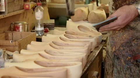 Clog maker is stamping the shoe size in the clogs Stock Footage 46995477