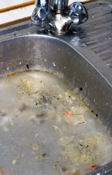 A clogged kitchen sink Stock Photos