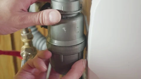Clogged sink pipe. Unclog a drain from hairs and other stuff. Stock Footage 128990729