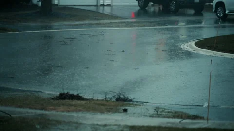Clogged street drain during heavy rain with water overflowing due to debris Stock Footage 332184646