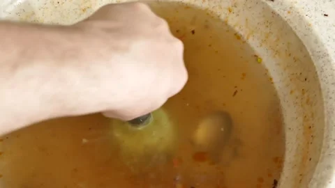 Clogging in the kitchen sink-dirty dishwater accumulated in the sink-a person 스톡 동영상 171072453