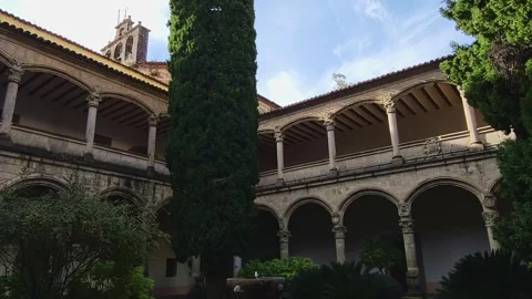Cloister of the Monastery of Yuste. Stone arches on two levels, a stone Stock Footage 341528216