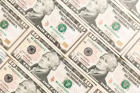 Close up of 10 dollar bills as a background. Amarican dollars pattern. Top .. Stock Photos