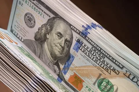 Close-up of 100 dollar banknotes. A large number of them. Stock Photos