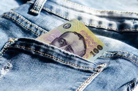 Close-up of 100  lei- ron    on the  back pocket jeans  . Stock Photos