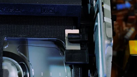 Close-up on an 18 age restricted analog VHS video cassette running 4k 스톡 동영상 123433390