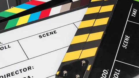 Close up of 2 clapper boards oR movie slate on the green background floor. Stock Photos