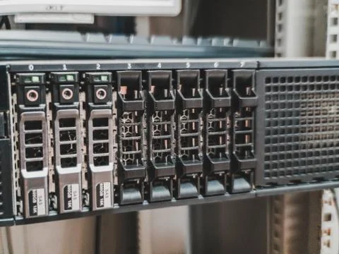 Close up of 2.5 inches hard drives bay in front of a working rack server inst Stock Photos