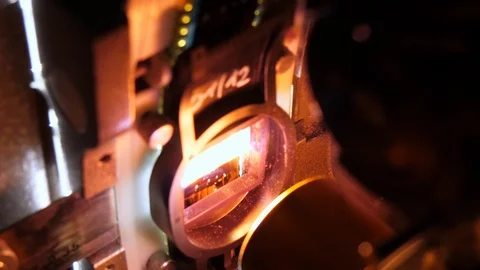 Close up of a 35mm cinema projector in a movie theater Stock Footage 93583560