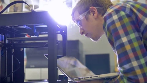Close up of the 3d printer and engineer working. 4K. Stock Footage