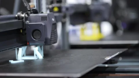 Close-up of 3D printer creating plastic object layer by layer Видео 345039803