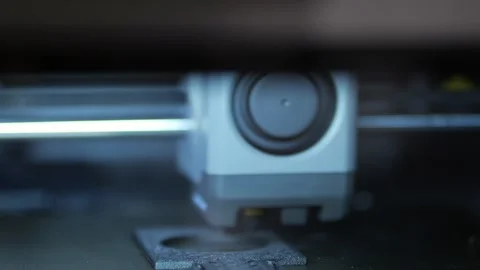Close-up of 3D printer head in action 스톡 동영상 345398837