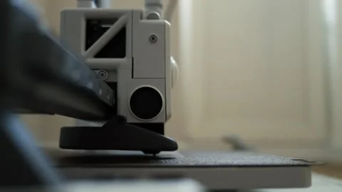 Close-up of a 3D printer head moving across a build plate Видео 339182425