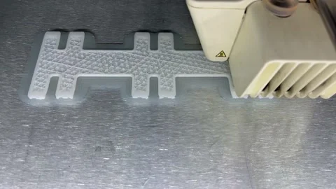 Close up of 3d Printer printing Stock Footage 214072799