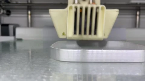 Close up of 3d Printer printing Stock Footage 216913531