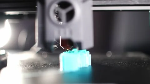Close up of a 3D printer printing a plastic detail Stock Footage 315771121
