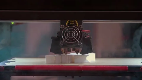 Close-up of 3d printer in process of creating some white shape figure. Stock Footage 166112673
