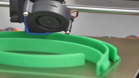 Close Up Of 3D Printer at work printing with green plastic filament Video stock 127713633