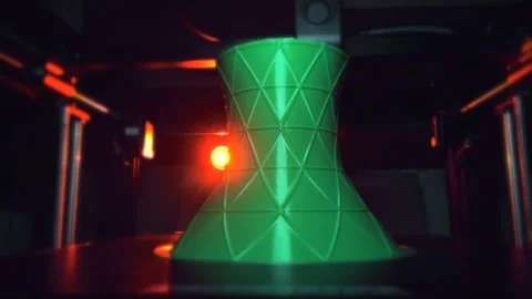 Close-up of a 3D printer working on a green vase with geometric triangular Stock Footage 318752331