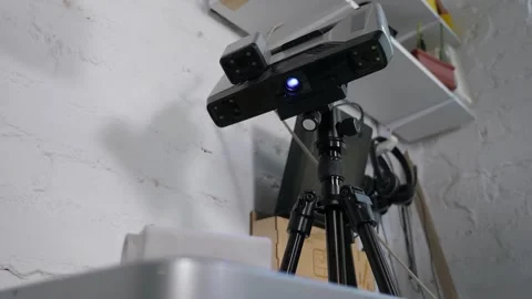 A close-up 3d scanner scans a plastic part for printing on a 3d printer. Stock Footage 312435496