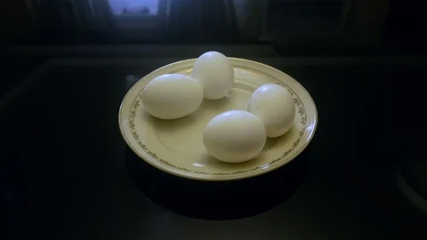 Close up of 4 eggs on the platter on the glass table, right side Stock Footage 104195629