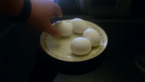 Close up of 4 eggs on the platter on the glass table Stock Footage 104195840