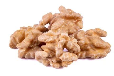 Close-up of 4 Walnuts on a White Background Stock Photos