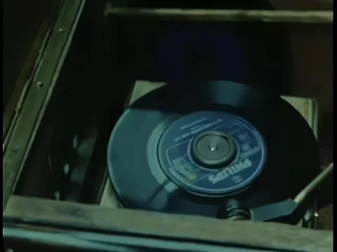 Close-up 45 rpm record playing on vintage record player Stock Footage 260249147