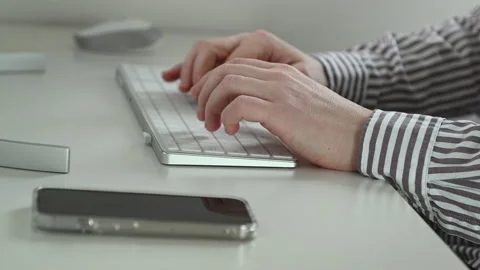 Close up 4K 60fps video of mans hands typing on keyboard befor computer worki Video stock 168440004