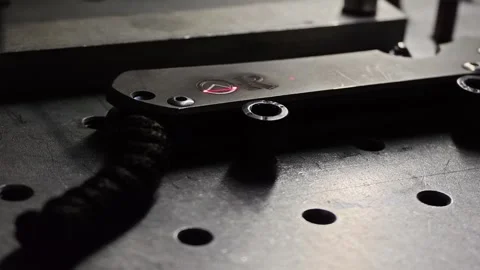Close Up 4K Laser Engraving on Titanium Pocket Knife Handle, Dramatic Sparks Stock Footage 342854251