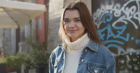 Close up 4k portrait of young dark haired woman on the street Stock Footage 144981571