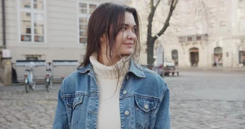 Close up 4k portrait of young dark haired woman on the street Stock Footage 144981594