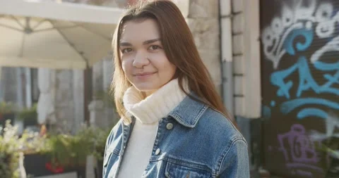 Close up 4k portrait of young dark haired woman on the street Stock Footage 144981596