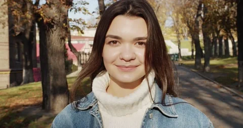 Close up 4k portrait of young dark haired woman on the street Stock Footage 144981850
