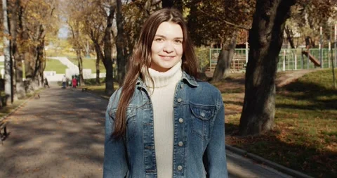 Close up 4k portrait of young dark haired woman on the street Stock Footage 144981871