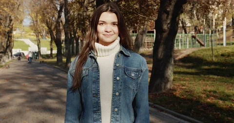 Close up 4k portrait of young dark haired woman on the street Stock Footage 144981922