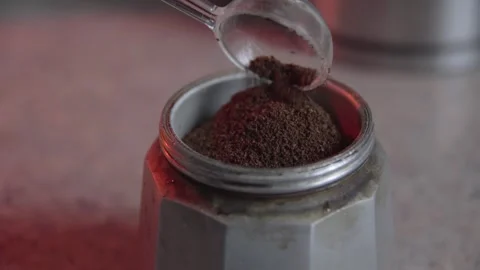 Close-Up 4K: Pouring Premium Coffee into a Moka Pot and Tamping with a Tran.. Stock Footage 332073057