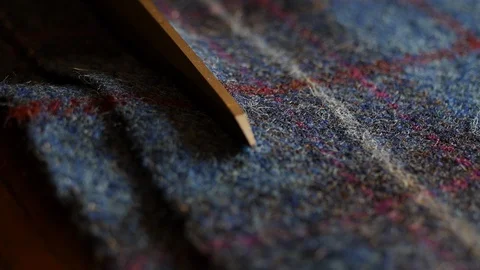 Close up 4k professional shot of Scissors cutting tweed wool fabric : bespoke Stock Footage 129014189