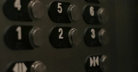 Close up 4K slow motion shot woman's finger push the button in elevator Stock Footage 138595764