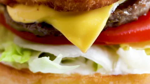 Close-up 4k video of a cheeseburger in a fast food restaurant. Stock Footage 168834118