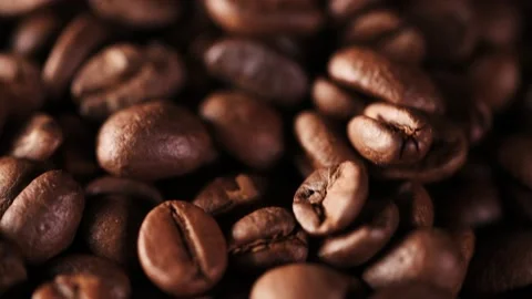 Close up 4K video of rotating coffee beans Stock Footage 147455782