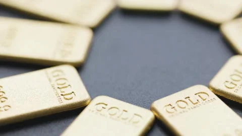 Close-up of 50 Gram Pure Gold Bullion Bars on a Reflective Surface Stock Footage 330200869