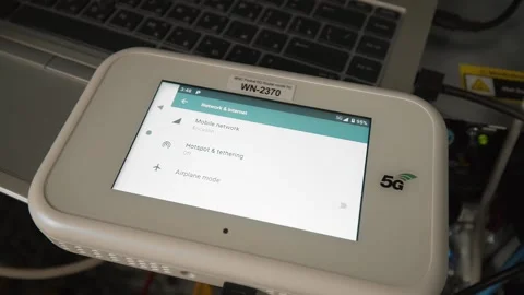 Close-up of a 5g network router in front of a server cabinet. Stock Footage 165409218