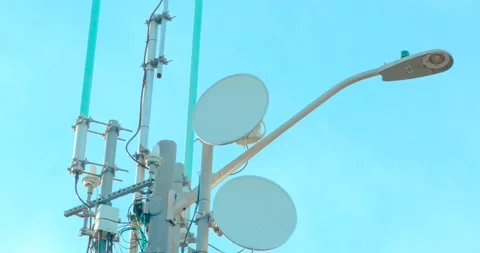 Close up of 5G small cell microwave dishes on urban utility pole Video stock 332892743