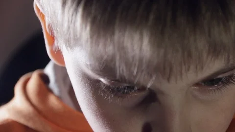 Close up of 7 year old caucasian white boy looking at  a laptop computer, learni Stock-Footage 87246885