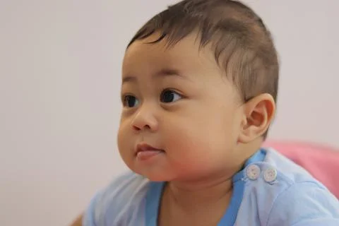 Close-up of an 8-month-old baby's face 写真素材