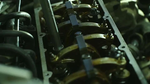 Close-up of 8-valve engine block as mechanic tightens cylinder head bolts with Stock Footage 311238636