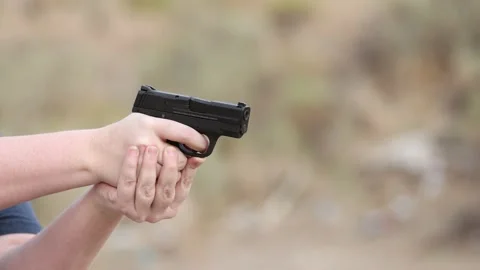 Close Up 9mm Smith and Wesson Gun in Slow Motion - Shallow Depth of Field Stock Footage 159465113